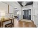 Foyer featuring hardwood floors, a dark ceiling with chandelier, and view to another room at 6024 N County Road 50 W, Lizton, IN 46149