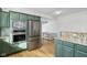 Eat-in kitchen featuring stainless appliances and custom green cabinetry at 6024 N County Road 50 W, Lizton, IN 46149