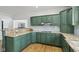 Eat-in kitchen with custom green cabinets, granite countertops, and stainless appliances at 6024 N County Road 50 W, Lizton, IN 46149