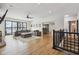 Open-concept living room showing fireplace, large sectional couch, and large sliding glass doors at 6024 N County Road 50 W, Lizton, IN 46149