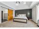 Spacious main bedroom with a tray ceiling, barn door, and neutral decor at 6024 N County Road 50 W, Lizton, IN 46149
