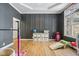 playroom area with wood floors, natural light, and gray accent wall at 6024 N County Road 50 W, Lizton, IN 46149