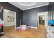 playroom area with wood floors and gray accent wall at 6024 N County Road 50 W, Lizton, IN 46149