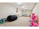 Spacious playroom with carpeted floors, natural light, and plenty of room for to play and explore at 6024 N County Road 50 W, Lizton, IN 46149