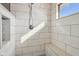 Modern shower with white subway tile, a rainfall showerhead, and a built-in bench at 6024 N County Road 50 W, Lizton, IN 46149