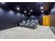 Home theater room with tiered seating, a large screen, and projector for an immersive movie-watching experience at 6024 N County Road 50 W, Lizton, IN 46149