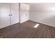 Bedroom featuring closet, wood-look floors, neutral paint, and natural light at 639 S Alpha Ave, Brownsburg, IN 46112