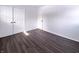 Bright bedroom with closet featuring wood-look floors and natural light at 639 S Alpha Ave, Brownsburg, IN 46112