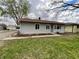 Cozy one-story home with a simple front yard, grey siding, and a new red roof at 639 S Alpha Ave, Brownsburg, IN 46112