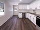 Modern kitchen showcasing new stainless steel appliances and an open concept layout at 639 S Alpha Ave, Brownsburg, IN 46112