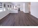 Bright living area with new hardwood flooring and seamless access to the kitchen at 639 S Alpha Ave, Brownsburg, IN 46112