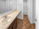 Bright bathroom with tan vanity, single sink, full mirror, and full bath with brown flooring at 6812 W Wintergreen Ct, McCordsville, IN 46055