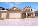 Charming two-story brick home with a two-car garage, complemented by a well-maintained lawn and inviting curb appeal at 6812 W Wintergreen Ct, McCordsville, IN 46055