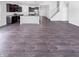 Open-concept kitchen with dark cabinetry, modern appliances, and a spacious island, ideal for cooking and entertaining at 6812 W Wintergreen Ct, McCordsville, IN 46055