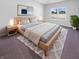 Inviting main bedroom with a comfortable bed, soft lighting, and a window overlooking the peaceful neighborhood at 6812 W Wintergreen Ct, McCordsville, IN 46055