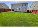 Large backyard featuring a well-maintained lawn and privacy fence, perfect for outdoor activities and entertaining at 6830 Shooting Star Dr, Whitestown, IN 46075
