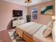 Comfortable bedroom with a ceiling fan, a large window, and stylish decor at 6830 Shooting Star Dr, Whitestown, IN 46075