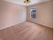 Empty bedroom with neutral walls, carpeted floors, a ceiling fan, and a bright window view at 6830 Shooting Star Dr, Whitestown, IN 46075
