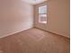 Bedroom featuring neutral walls, plush carpet, and a window for natural light at 6830 Shooting Star Dr, Whitestown, IN 46075