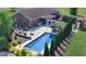 Aerial view of home highlighting the in-ground pool, patio, shed, and tree-lined backyard at 7152 Old Morgantown Rd, Martinsville, IN 46151