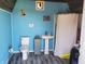 Bathroom in the shed features a toilet, sink, trash can, and shower at 7152 Old Morgantown Rd, Martinsville, IN 46151