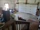Spacious garage area with overhead door and additional storage space, and a stairwell at 7152 Old Morgantown Rd, Martinsville, IN 46151