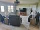 Living room with natural light, leather furniture, hardwood floors, and neutral wall paint at 7152 Old Morgantown Rd, Martinsville, IN 46151