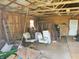 Interior of outbuilding featuring exposed rafters, bare walls, and some stored items at 7152 Old Morgantown Rd, Martinsville, IN 46151