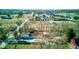 Aerial view of a residential property featuring a large home, barn, and expansive green space at 724 E 199Th St, Westfield, IN 46074