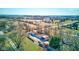 Aerial view of the property, showcasing the house, garages, yard, and surrounding landscape at 724 E 199Th St, Westfield, IN 46074