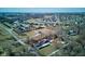 Aerial view of the home, barn, and landscape, with a neighborhood and water feature in the distance at 724 E 199Th St, Westfield, IN 46074