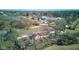 Overhead view of the property, featuring a home, barn, and expansive grounds surrounded by trees at 724 E 199Th St, Westfield, IN 46074