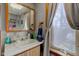 Bathroom featuring a vanity with storage and a window with curtains at 724 E 199Th St, Westfield, IN 46074