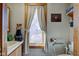 Cozy bathroom with a window, vanity, and toilet with safety bar at 724 E 199Th St, Westfield, IN 46074