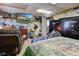 Bedroom featuring a TV, gun safe, dresser, and recliner at 724 E 199Th St, Westfield, IN 46074