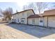 A lovely rear exterior view, showing the ample parking and access to the garage at 724 E 199Th St, Westfield, IN 46074
