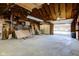 Large garage with concrete floors, wood beams and open garage door at 724 E 199Th St, Westfield, IN 46074