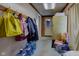Hallway with bags, coats hanging, a refrigerator, and storage items at 724 E 199Th St, Westfield, IN 46074