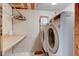 Laundry room with a washing machine, dryer, and folding table at 724 E 199Th St, Westfield, IN 46074