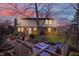 Beautiful backyard with a brick patio, outdoor seating, and a fire pit for entertaining at 7344 Monon Cir, Indianapolis, IN 46256