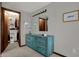 Bedroom with an antique blue dresser and a walk-in closet with shelving and organizational features at 7344 Monon Cir, Indianapolis, IN 46256