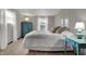Bright bedroom featuring a queen-size bed, neutral walls, carpet, and large windows with bright natural light at 7344 Monon Cir, Indianapolis, IN 46256