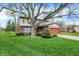 Charming two-story home featuring well-maintained lawn and mature trees at 7344 Monon Cir, Indianapolis, IN 46256