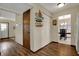 Hallway featuring hardwood floors, a closet, and doorways to other rooms in the home at 7344 Monon Cir, Indianapolis, IN 46256