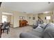 Comfortable living room featuring neutral walls, plush carpeting, and comfortable seating arrangements at 7344 Monon Cir, Indianapolis, IN 46256