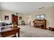 Spacious living room with wood accents, neutral walls, carpet, and cozy furnishings at 7344 Monon Cir, Indianapolis, IN 46256