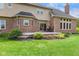Inviting backyard deck with seating, beautiful landscaping and sliding glass door entry at 7357 Windridge Way, Brownsburg, IN 46112