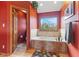 Stylish bathroom featuring a large bathtub, window view, and wood trim doorway at 7357 Windridge Way, Brownsburg, IN 46112