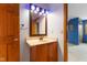 Bathroom featuring a modern sink, vanity, mirror, and light blue walls at 7357 Windridge Way, Brownsburg, IN 46112