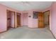 Spacious pink bedroom featuring 3 wood doors at 7357 Windridge Way, Brownsburg, IN 46112